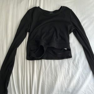 Black long sleeved top from Forever21 with crossed stripes on the bottom